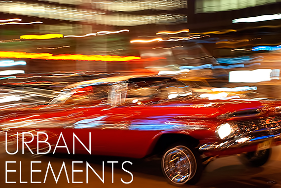 colorful liquor bottles on display shelves by Christopher Petsos