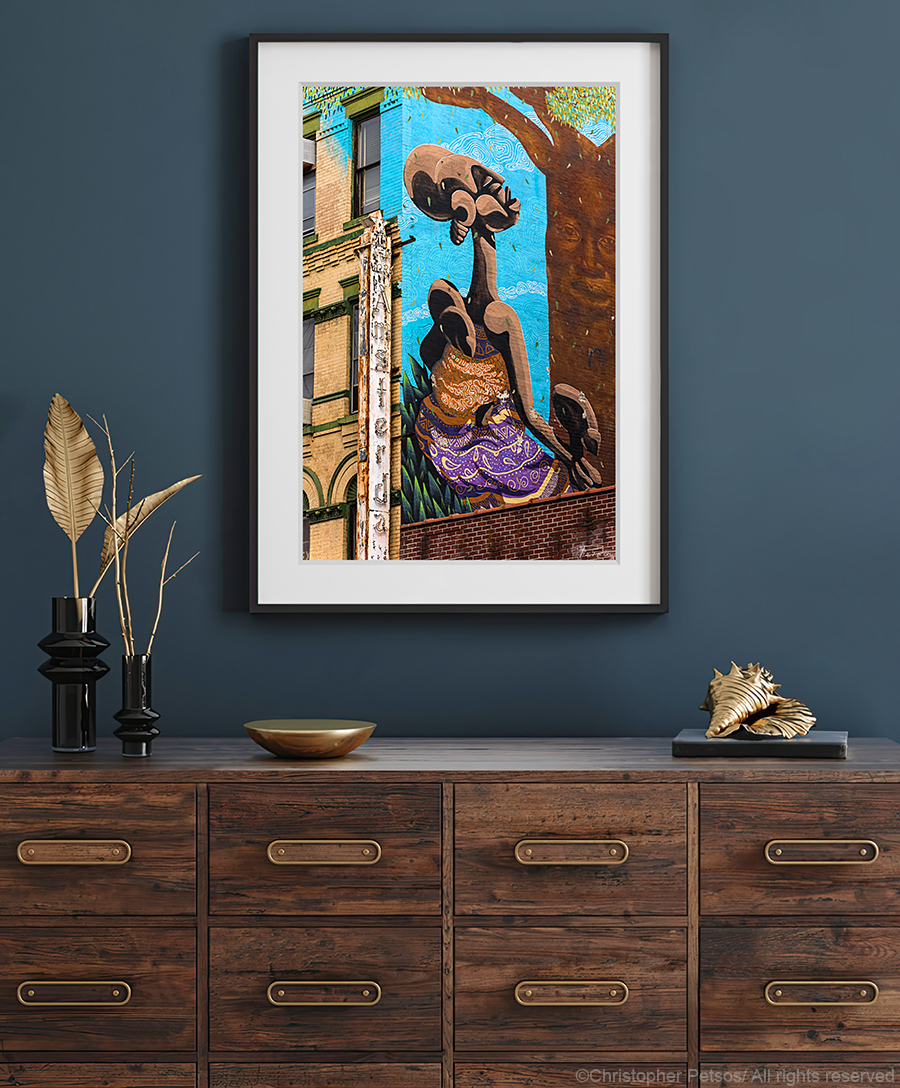 Amsterddam News Harlem building photograph by Christopher Petsos displayed above a wooden dresser